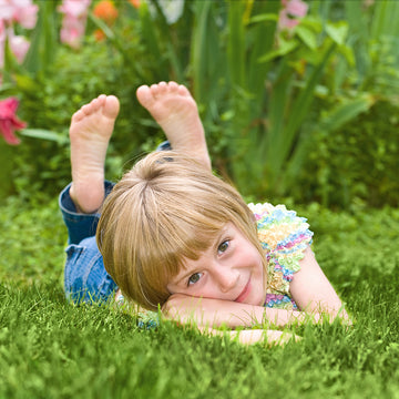 Girl Laying On Aravalli Artificial Grass